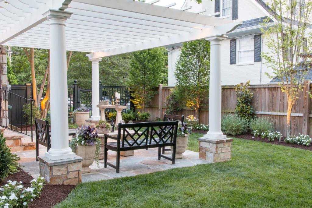 white pergola covering bench area