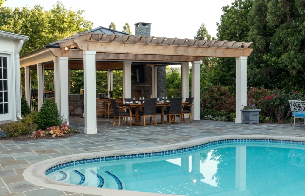 pergola with dining table and pool