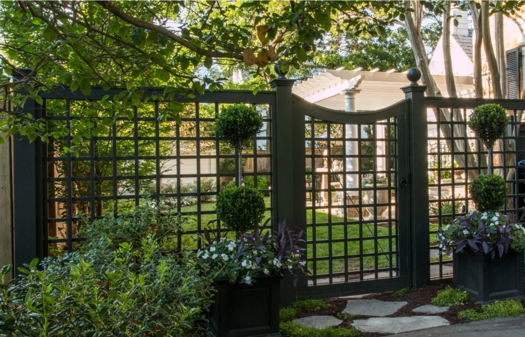 fence separating garden and backyard