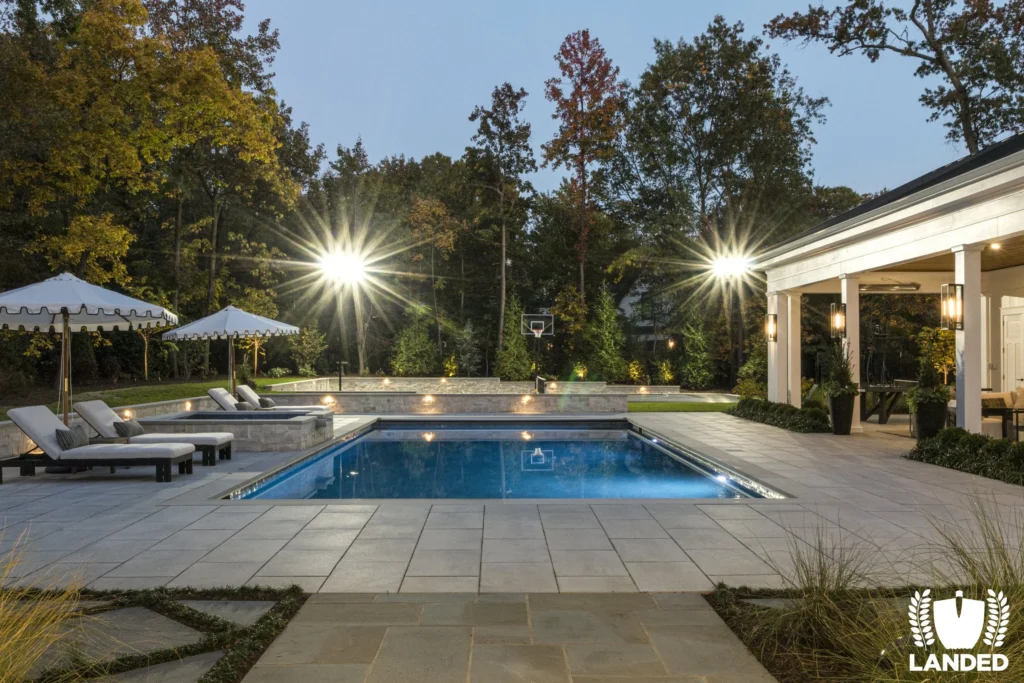 sportcourt spotlighting in backyard with pool