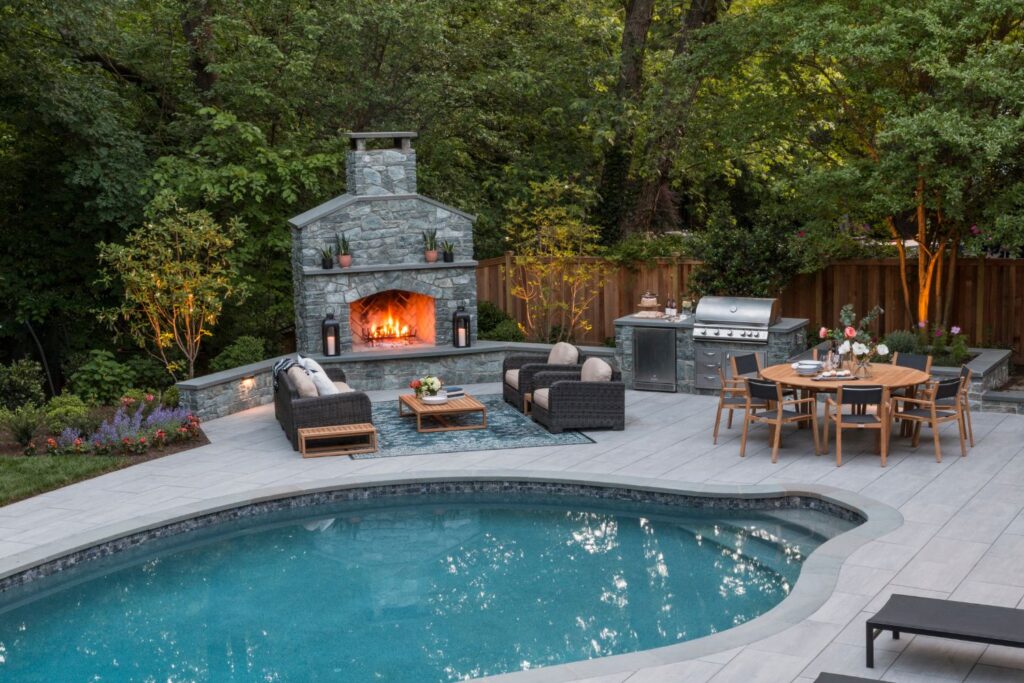 Beautiful outdoor fireplace kitchen and pool in northern Virginia